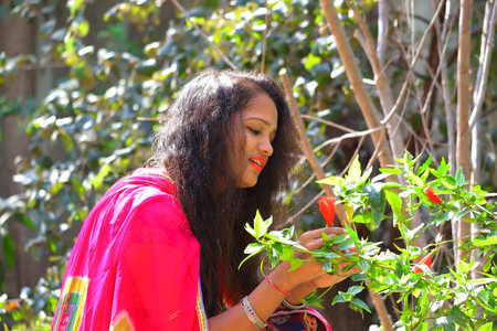 09 March 2020,India Rajasthan, A young beautiful girl open bright black hair and wearing bangles in...