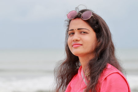 happiness Hindu woman's beautiful face nature revolution with closeup profile view and wearing...