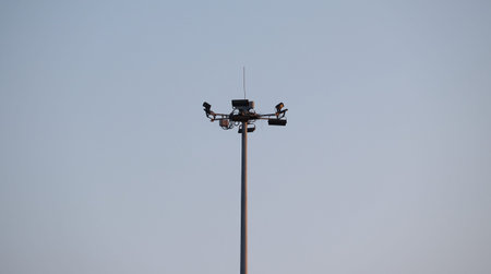 Low angle shot road light before sunrise in the morning against blue sky