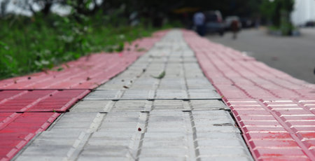 pattern board empty tiles in front of blurred background. Perspective red and brown tile over blur...