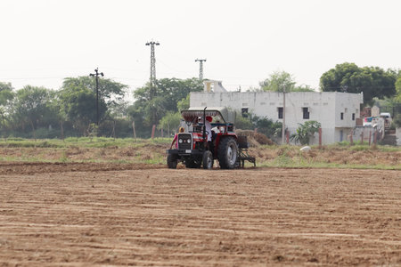 leelmaba ,pali Rajasthan , India .â€ŽOctober â€Ž26 â€Ž2021 .Farmer sowing Kharif crop in...