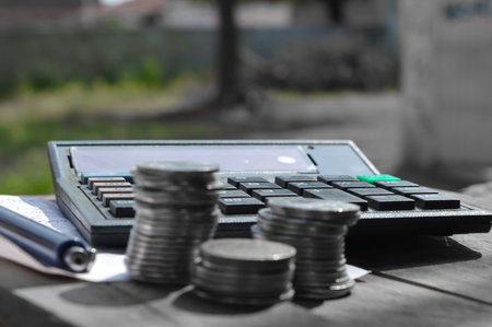 calculate on wooden table,mean focus on calculate