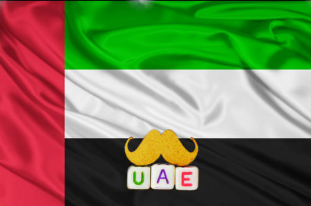 uae real texture flag,uae flag and text written UAE on mustaches meaning strong,waving fabric texture of the flag with color of united arab emirates,United Arab Emirates flag の写真素材