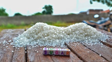 sugar text writing colorful,colorful text writing on wooden background letter sugar,sugar の写真素材