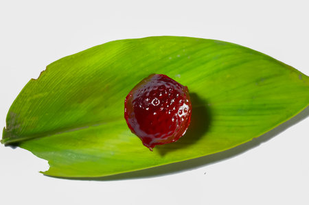 red jelly on green leaves,render jelly on white background,jelly small piece,green leaves red jelly
