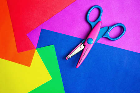 Colorful paper with child's scissorsの写真素材
