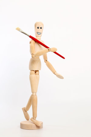 Wooden dummy with red brushの写真素材