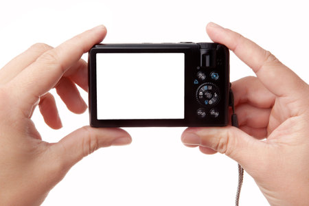 Hands holding digital photo camera with free space for your imageの写真素材