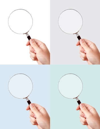 Looking trough magnifying glass in hand, colored background setの写真素材