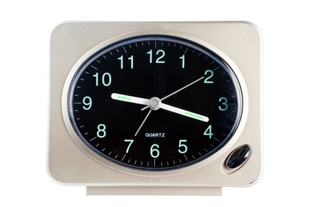 Used scratched table quartz alarm clock, isolated on white background 