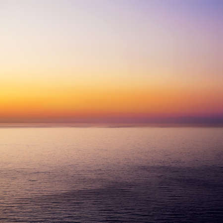 Abstract marine background - purple sunset over the seaの写真素材
