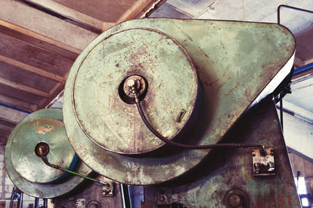 A part of an old industrial rusty electric heavy machinery in the plant の写真素材