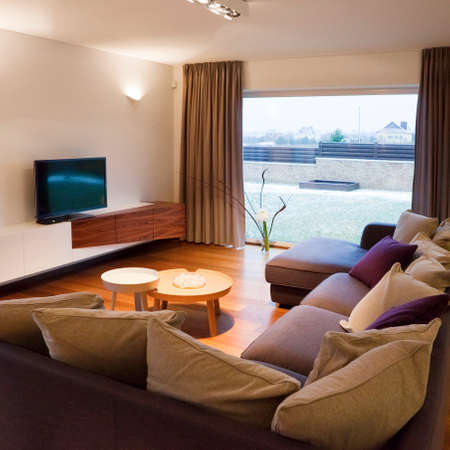 Interior design - cozy living room with TV set and large window の写真素材