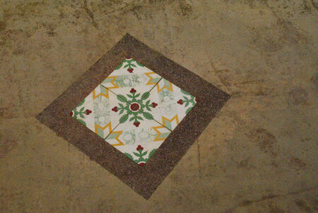 Ornate old pattern mosaic on floor at street of Malacca Townの写真素材