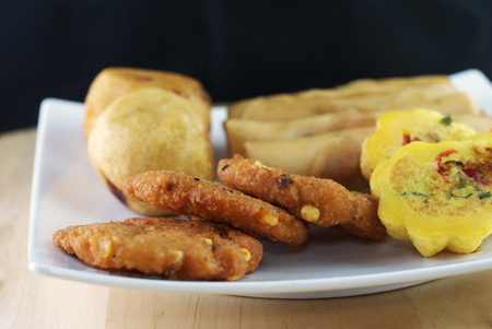 Assorted Malay traditional food - Kuih Cara Berlauk, Cucur Badak, Popiah, Vadeh - Focus on Vadehの写真素材