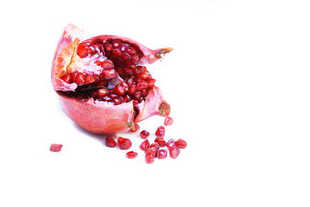 Cut open ripe Pomegranate fruit or Buah Delimaの写真素材