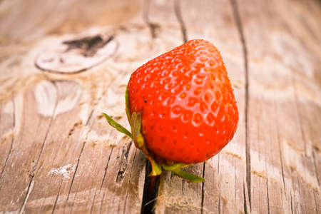 Isolated red berry on the wooden backgroundの写真素材