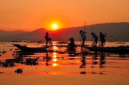 Fishermen in Inle lakes sunset Fishermen is finish a day of fishing in Inle lake, Myanmar  Burma   Inle is one of the most favorite tourist places in Myanmar  Burma の写真素材