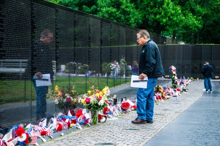 WASHINGTON, D C  - MAY 27, 2013  People visit and lay flowers at the Vietnam Veterans Memorial on May 27, 2013, in Washington, D C  のeditorial素材