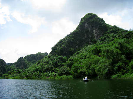 NINH BINH, VIETNAM, JULY, 20: Unidentified tourists in Trang An  on JULY, 20, 2013. Trang An is the scenic area, ranked special of Vietnam.のeditorial素材