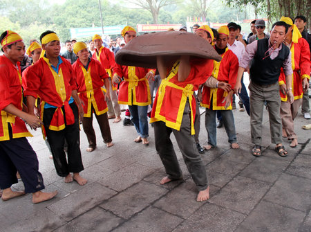 HAI DUONG, VIETNAM, February, 25: Vietnamese farmers play firecracker, wich made by land, unique folk game on February, 25, 2013 in Con Son pagoda, Chi Linh, Hai Duong, Vietnamのeditorial素材