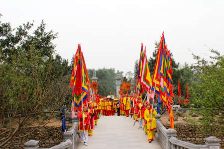 HAI DUONG, VIETNAM, February, 25: Group of people in traditional costume give gifts to the holy at Con Son, Kiep Bac festival on February, 25, 2013 in Hai Duong, Vietnam.. To give gifts to the holy is the sacred ceremonie of festival.のeditorial素材