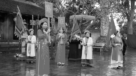 HAI DUONG, VIETNAM, March 29: people in traditional costumes arrange letters in new year for luck at Mao Dien temple on March, 29, 2014 in Hai Duong, Vietnam. This is the beauty to honor the learning. のeditorial素材