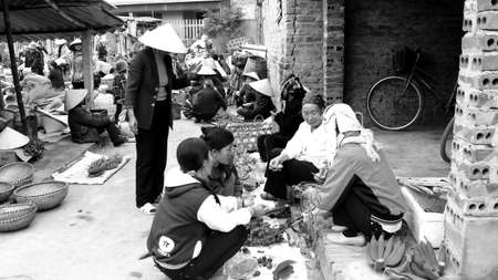 Asian woman selling banana in the market. HAI DUONG, VIETNAM, APRIL, 10: Asian woman selling banana in the market on April, 10  in Hai Duong, Vietnam. のeditorial素材