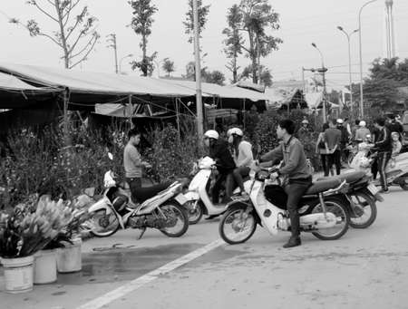 HAI DUONG, VIETNAM, APRIL, 10: Asian man buying flowers in the market on April, 10  in Hai Duong, Vietnam. のeditorial素材