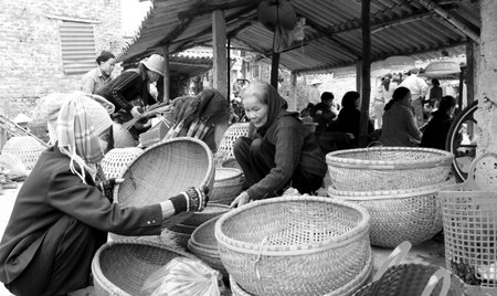 HAI DUONG, VIETNAM, APRIL, 10: Asian woman selling bamboo basket at market on April, 10  in Hai Duong, Vietnam. のeditorial素材