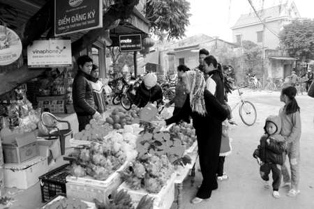 HAI DUONG, VIETNAM, APRIL, 10: Asian women selling fruit in the market  on April, 10  in Hai Duong, Vietnam. のeditorial素材