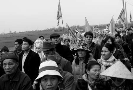 HAI DUONG, VIETNAM, March, 4: Group of people in traditional costume give gifts to the holy at Cao temple festival on March, 4, 2013 in Hai Duong, Vietnam. This is sacred ceremonie of festival.のeditorial素材