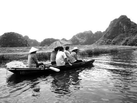 NINH BINH, VIETNAM, JULY, 20: Unidentified tourists in Trang An  on JULY, 20, 2013. Trang An is the scenic area, ranked special of Vietnam.のeditorial素材