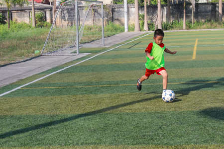 HAI DUONG, VIETNAM, JULY, 30: boys playing football on the court on july, 30, 2014 in Hai Duong, Vietnam.のeditorial素材