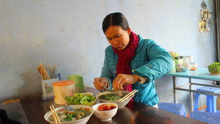 HAI DUONG, VIETNAM, January,30: woman eat fish noodle on January, 30, 2014 in Hai Duong, Vietnam