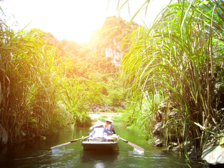 NINH BINH, VIETNAM, JULY, 20: Unidentified tourists in Trang An  on JULY, 20, 2013. Trang An is the scenic area, ranked special of Vietnam.のeditorial素材