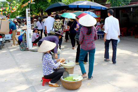 HAI DUONG, VIETNAM, SEPTEMBER, 10: Woman selling fried rice in the market on September, 10, 2014 in Hai Duong, Vietnamのeditorial素材