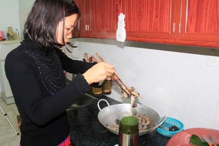 Haiduong, Vietnam, February, 14: woman make spring rolls on February, 14, 2015 in Hai Duong, Vietnamのeditorial素材