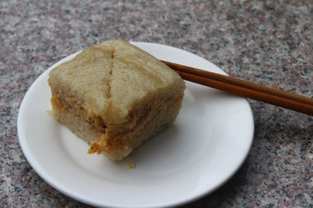 steamed dumpling on plate with chopsticks