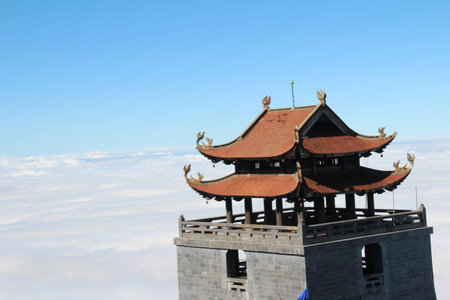 The roof of the pagoda in the clouds, closeup of photoの写真素材
