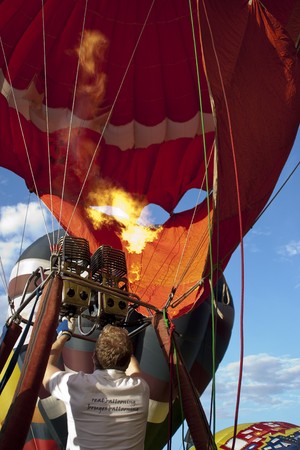 PUTRAJAYA, MALAYSIA - MAR 21 : Participants of the 2nd Putrajaya International Hot Air Balloon Fiesta 2010 prepare a balloon for takeoff March 21, 2010 in Putrajaya, Malaysia.のeditorial素材
