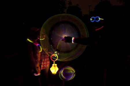KUALA LUMPUR, MALAYSIA-MAR 26:Abu Bakar Rashid and family play with glow-in-the-dark stick during Earth Hour Campaign at the National Planetarium on Mar 26, 2011 in Kuala Lumpur.More than 4,000 cities in 131 countries celebrate Earth Hour.のeditorial素材