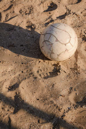 Ball lying on the sand in the summer.の写真素材