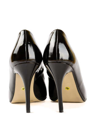 Women's leather shoes with high heels in the business style isolated on white backgroundの写真素材