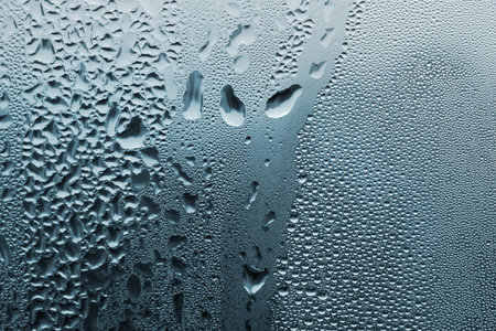 Natural large and fine water drops on glass backgroundの写真素材
