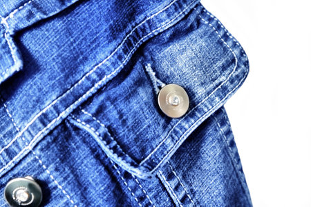 fragment of jeans jacket close-up on the white backgroundの写真素材