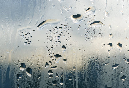 natural water drops on window glassの写真素材