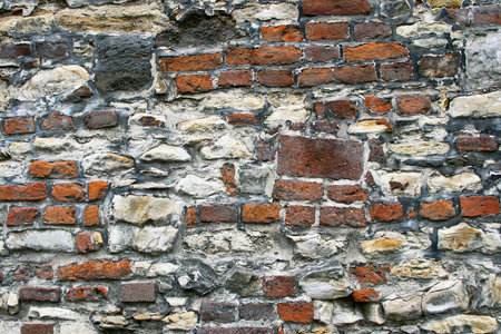 Ancient stone and brick wall backgroundの写真素材