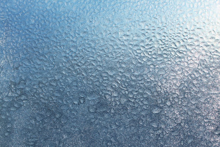 texture of frozen water drops on glassの写真素材