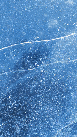 Natural ice texture, winter background, surface of a frozen riverの写真素材